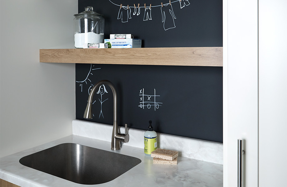  A floating shelf over a sink with a writable surface backdrop 